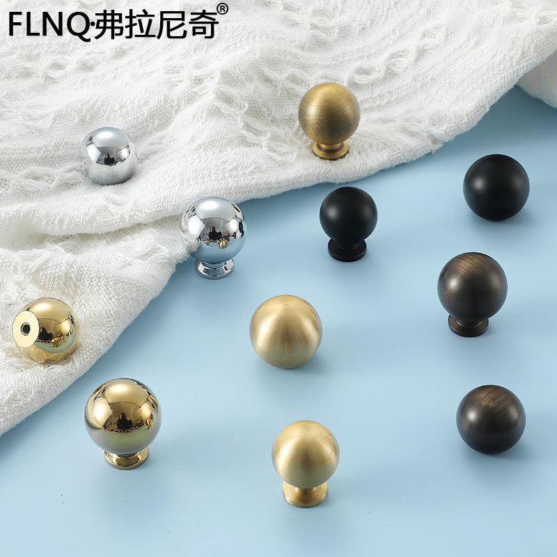 Modern minimalist round ball-style French-inspired bright silver cabinet door handle, pure copper golden finish—elegant and understated kitchen drawer pull with all-copper design