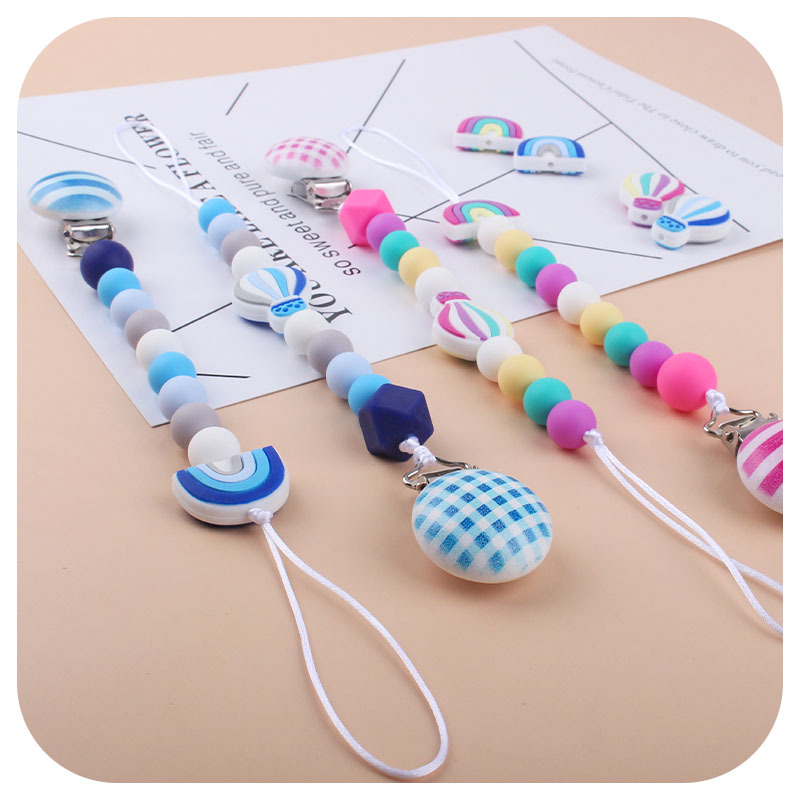 Nuevo bebé dibujos animados globo de aire caliente pulsera de silicona teether palo pezón cadena anti-gota cadena juguete teether