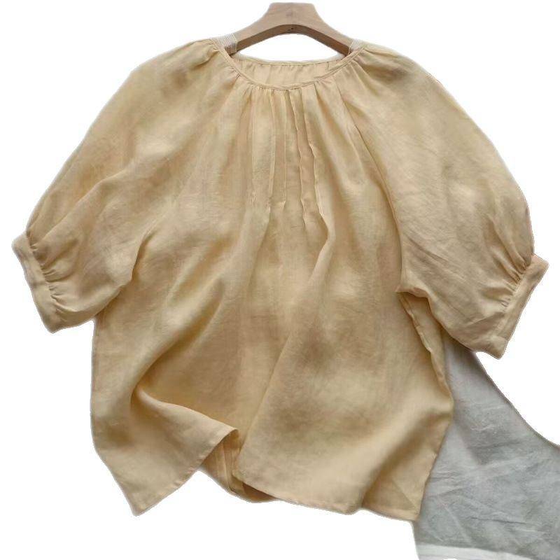 年齢を減らす子供の襟の泡の袖の乳の黄色のシャツの女性の2025夏の新型の気質の純色のシンプルでゆったりしている上着