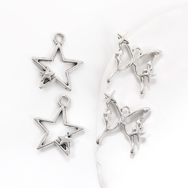 Wholesale retro star star butterfly hollow pendant DIY alloy jewelry accessories A800316