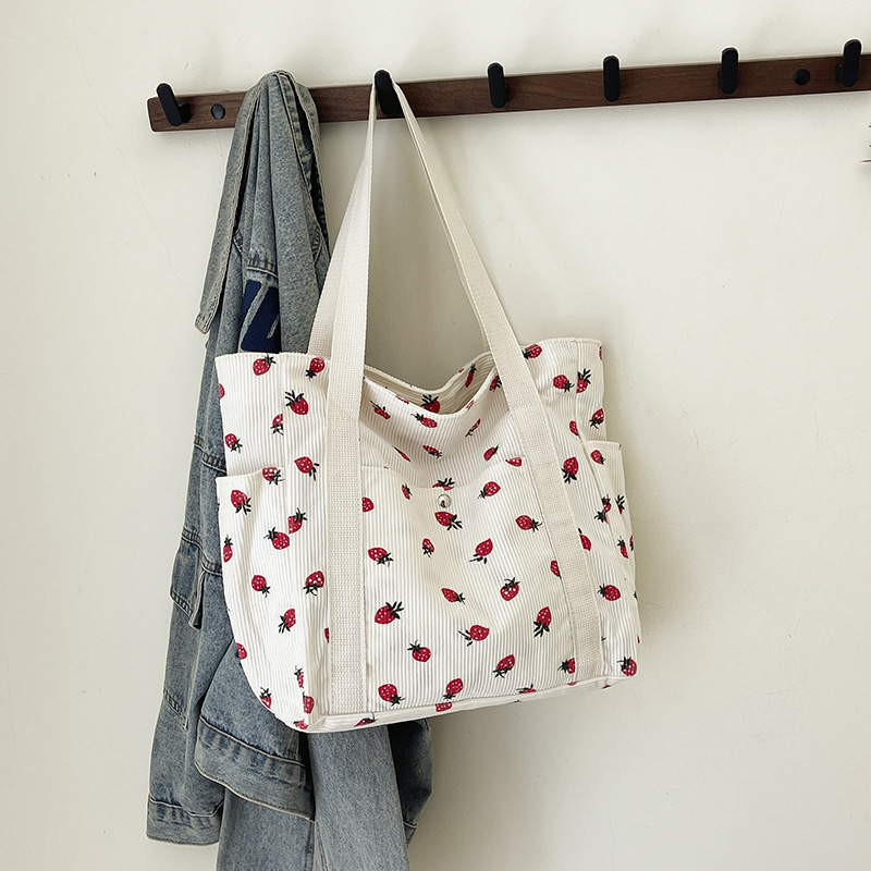 2025 verano nuevo bolso de mano de gran capacidad simple estilo universitario de moda ocio de tela de meandarra bolso de hombro