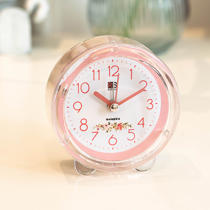 Ventas de fábrica reloj despertador de plástico redondo estudiante reloj de color caramelo con luz de dibujos animados claro reloj despertador fácil de llevar