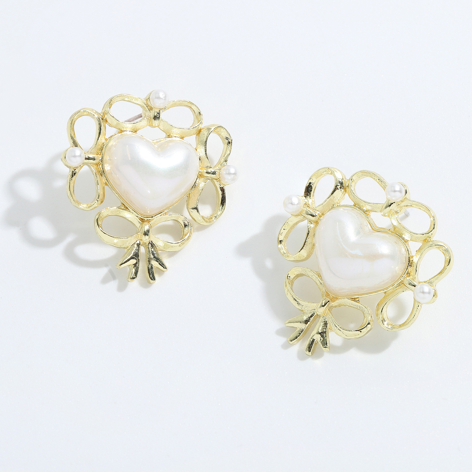 Korean Heart Alloy Inlaid Pearl Earrings display picture 6