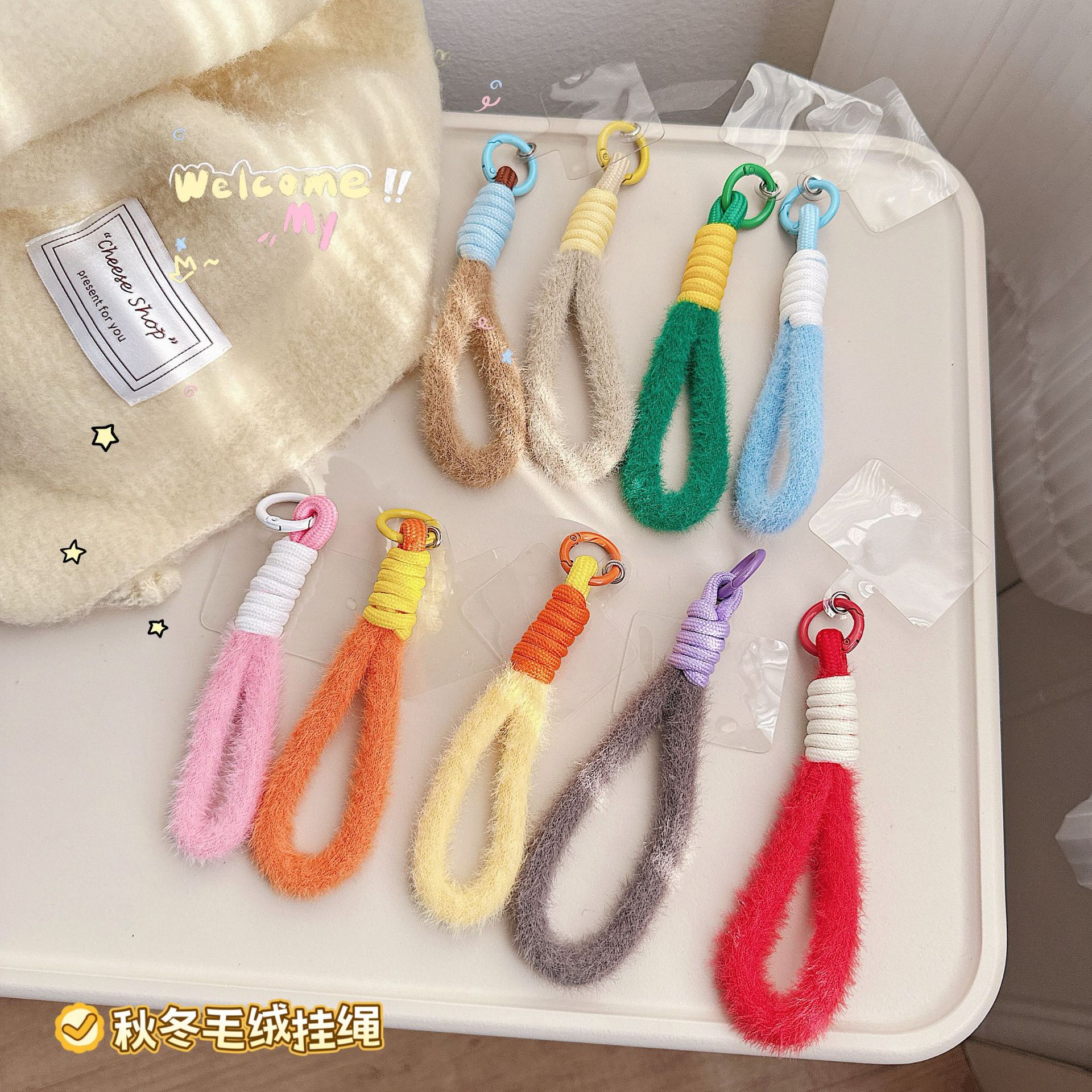 Otoño y invierno de peluche para teléfonos móviles colgantes de cámara de color llavero anti-perder pulsera cuerda bolsa trenzada corta colgante