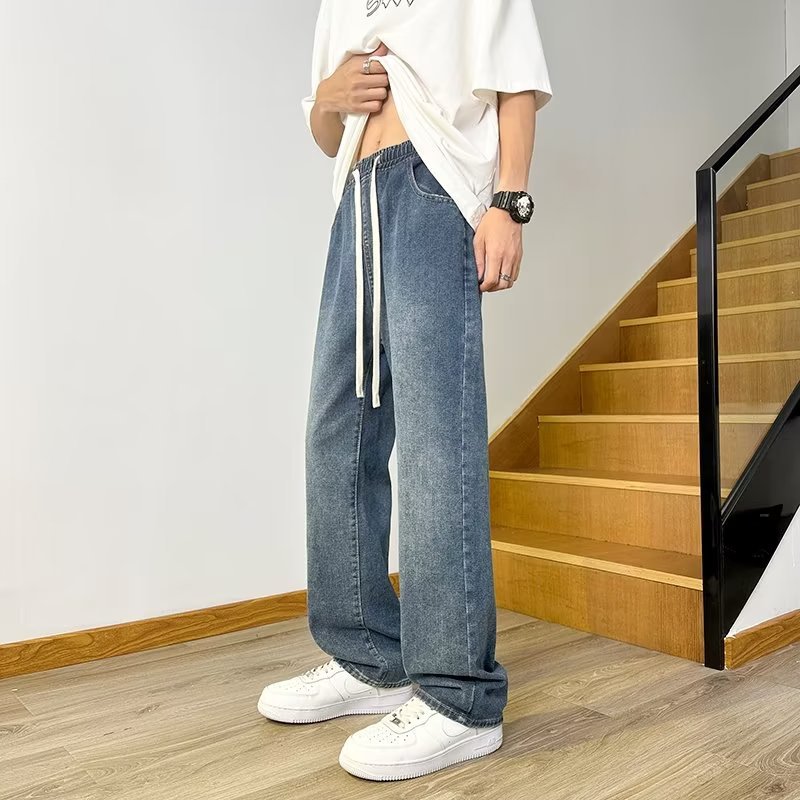 Vaqueros americanos, pantalones teñidos de barro amarillo de seda de hielo viejos lavados de verano para hombres, pantalones rectos sueltos de la marca de moda de la calle principal