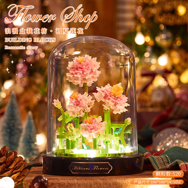 積み木の花がバラのオルゴールを飾っています。|undefined