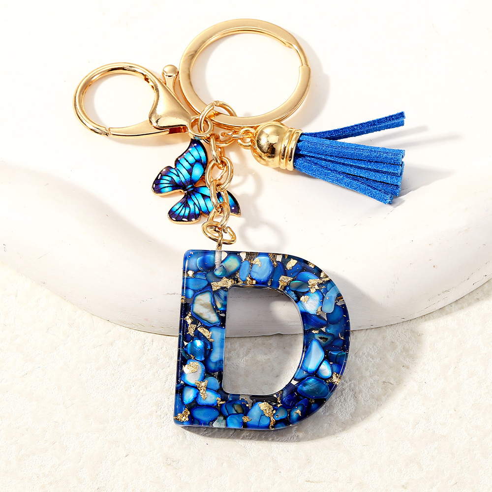 Nuevo transfronterizo mariposa 26 letras inglesas de cristal goteo llavero bolsos accesorios colgante de automóviles