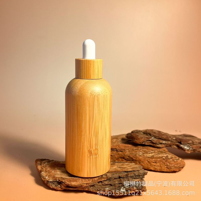 竹のゴムの頭の点滴の瓶の精華の液体の携帯は瓶の竹の製の光を避ける精華を分けて瓶の竹の木を分けて瓶を詰めます|undefined
