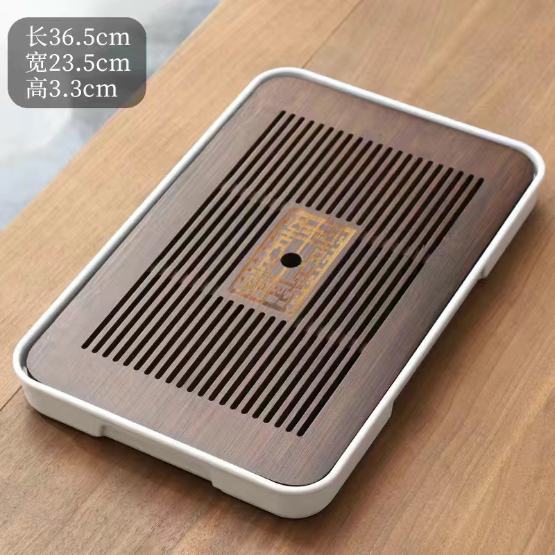 シンプルな竹製のお茶の皿の工夫の茶器は水を切って排水のお茶のトレーを蓄えます。|undefined