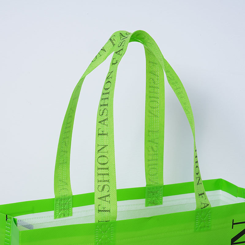 Bolsas de tela no tejida de película creativa espesa bolsa de ropa tienda de ropa bolsa de compras de mano ecológica bolsa de tela no tejida personalizada image 4