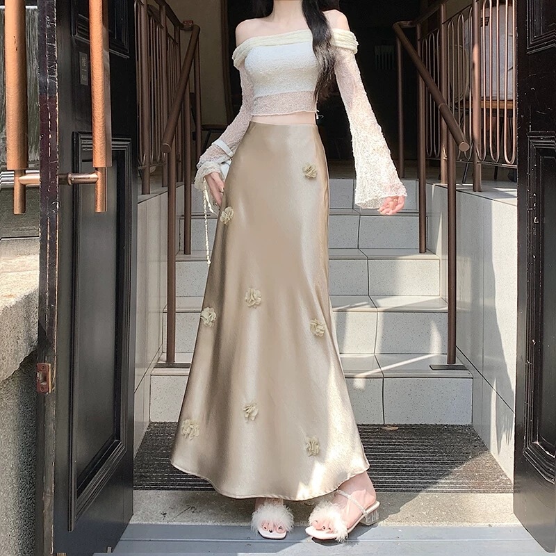 Champagne-Colored Satin Skirt for Women, Spring Design with Three-Dimensional Floral Accents, Elegant Slim-Fit Hip-Hugging Long Skirt, Available for Wholesale Champagne-Colored Satin Skirt for Women, Spring Design with Three-Dimensional Floral Accents, Elegant Slim-Fit Hip-Hugging Long Skirt, Available for Wholesale