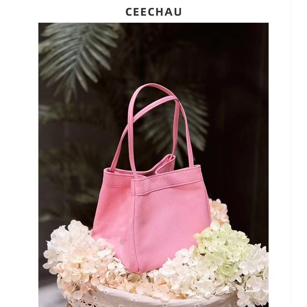 Fábrica al por mayor nuevo estilo coreano de la capa superior de la PU de cuero de mano que lleva pequeña bolsa cuadrada todo-fósforo cubo bolsa de nicho de moda portátil bolso de las mujeres