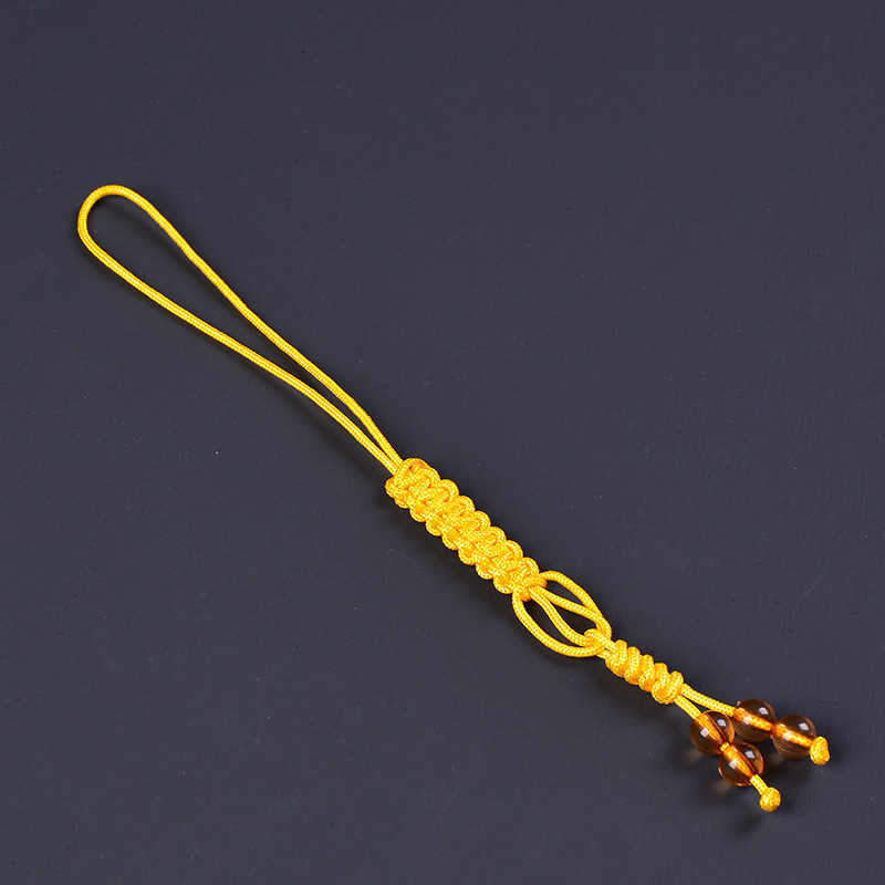 Amarillo con cuentas atadas a cuerda de olla