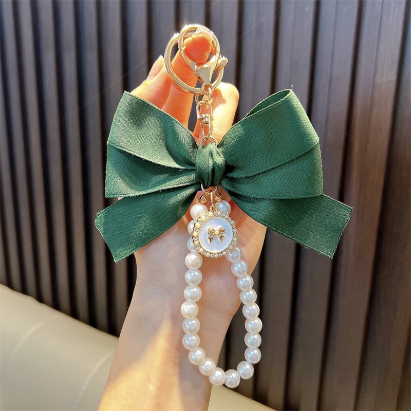 Perlas hechas a mano llaveros de perlas mujeres arco de correa de color bolsos colgantes pequeños regalos al por mayor