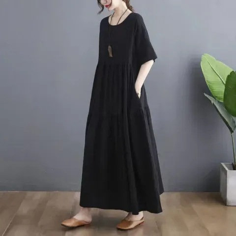Summer fashion, artistic design for plus-size women: Large-size cotton-linen short-sleeve dress with paneling—perfect for hiding belly area, creating a slimming effect, and offering a relaxed, flowy silhouette.