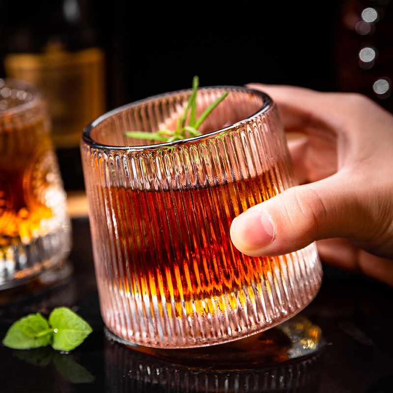 Glass rotating wineglass for whiskey