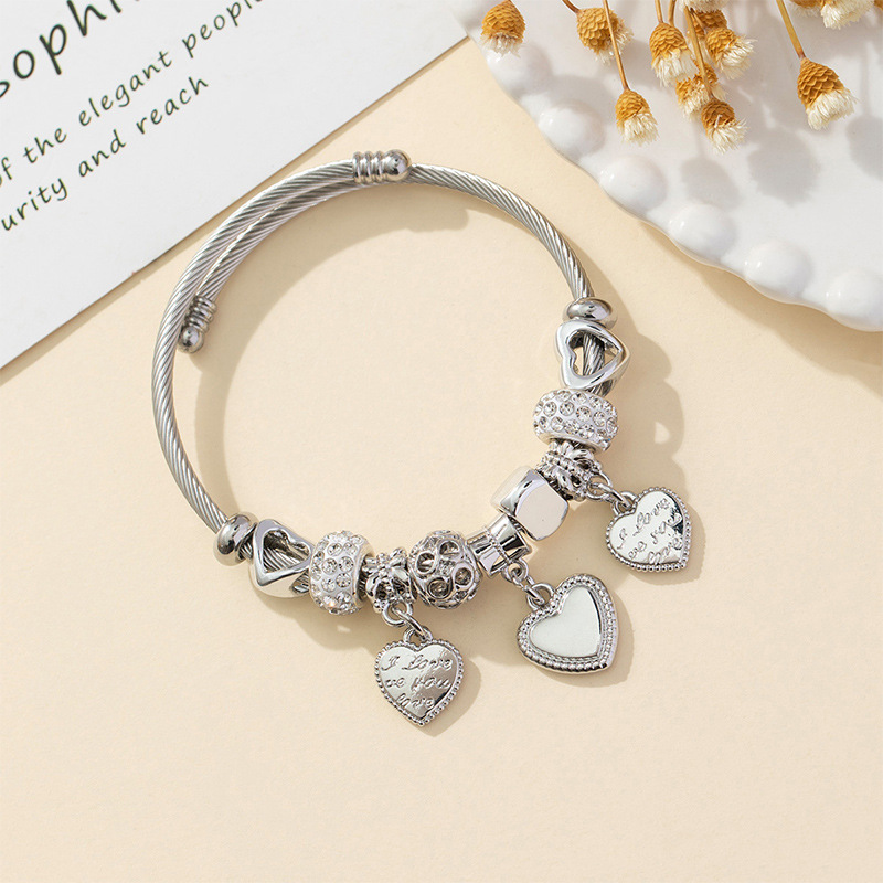 Panjia pulsera Dora DIY cuentas explosivas transfronterizas anillo de acero inoxidable bola de perforación aleación de letra en forma de corazón brazalete accesorios