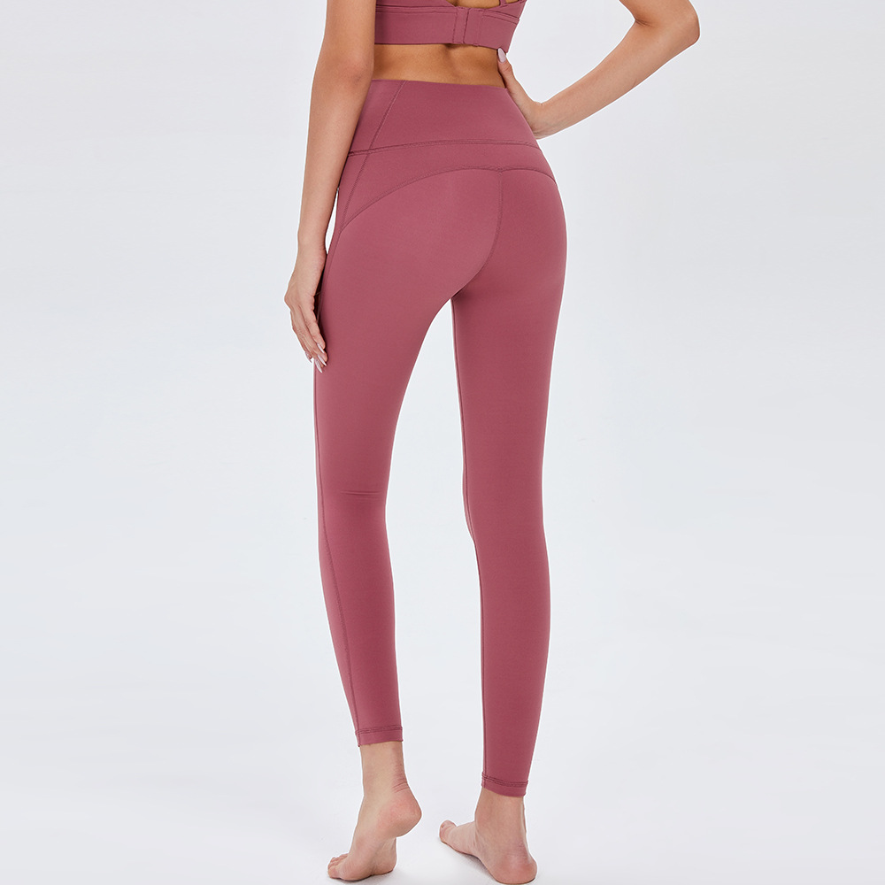 Pantalones de Yoga de cintura alta desnuda europea y americana de las mujeres Peach Hip lifting Pantalones deportivos ajustados pantalones de fitness de secado rápido