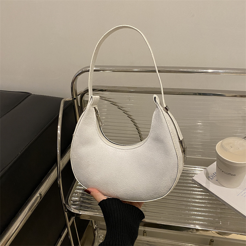 Bolsa de media luna francesa nicho para mujeres 2025 verano nuevo estilo de moda de color sólido esmerilado textura de moda bolso de hombro bolso debajo de la axila