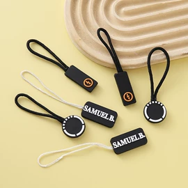 拉链头;洗唛、商标;搪胶公仔