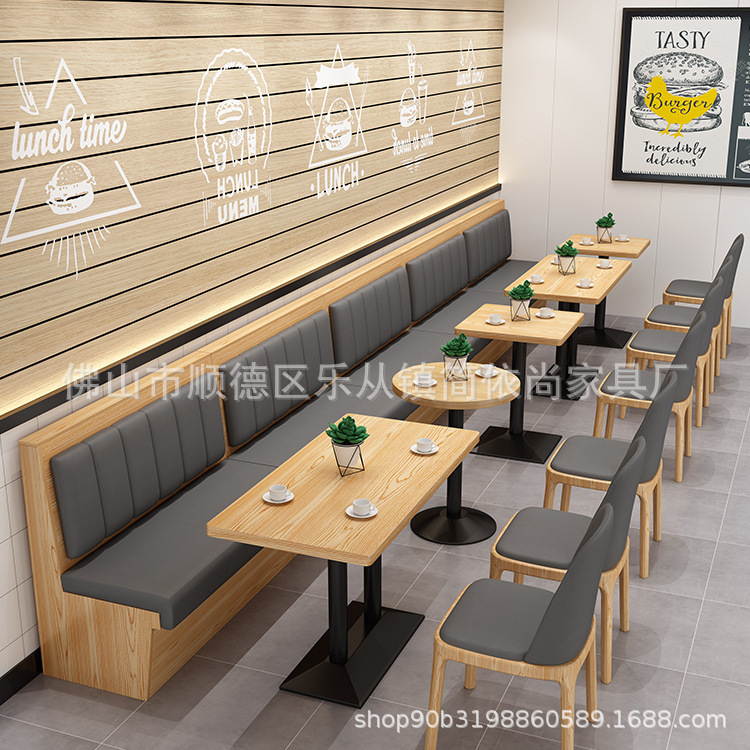 テーマレストランのテーブルと椅子の飲食ハンバーガー鍋焼肉ミルクティー店の喫茶店は壁のカードのソファーの組み合わせに寄りかかっています。|undefined
