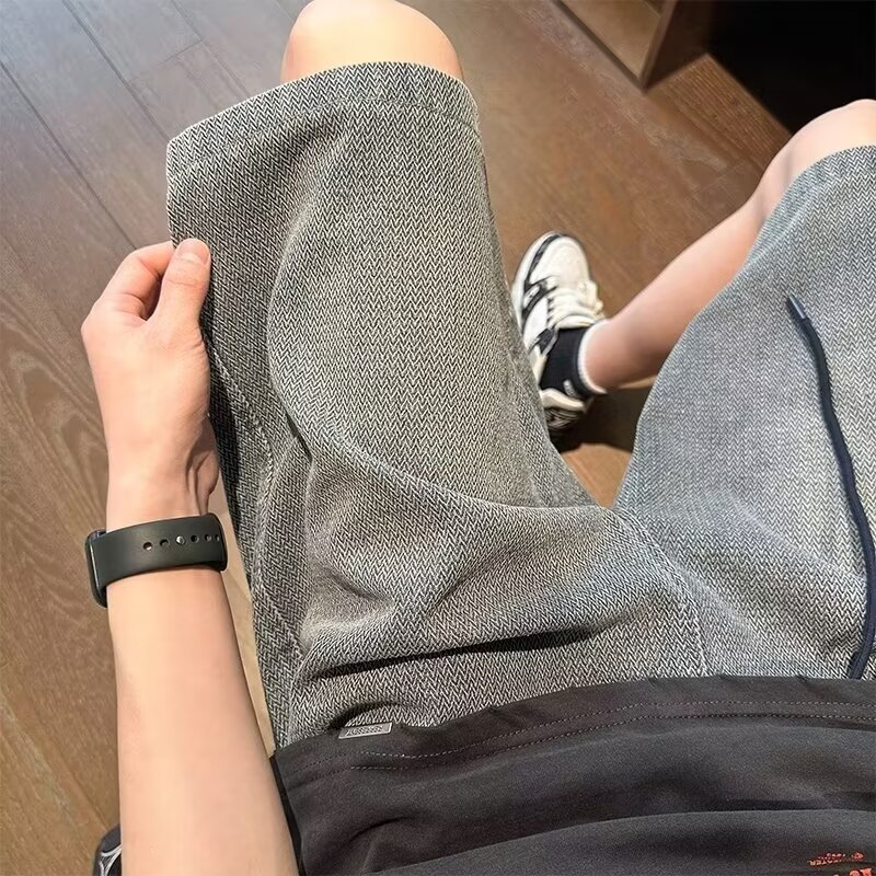 Pantalones casuales cortos de mezclilla de moda lavados, pantalones delgados de verano para hombres, pantalones deportivos rectos de todo fósforo de la calle americana, pantalones de cinco puntos