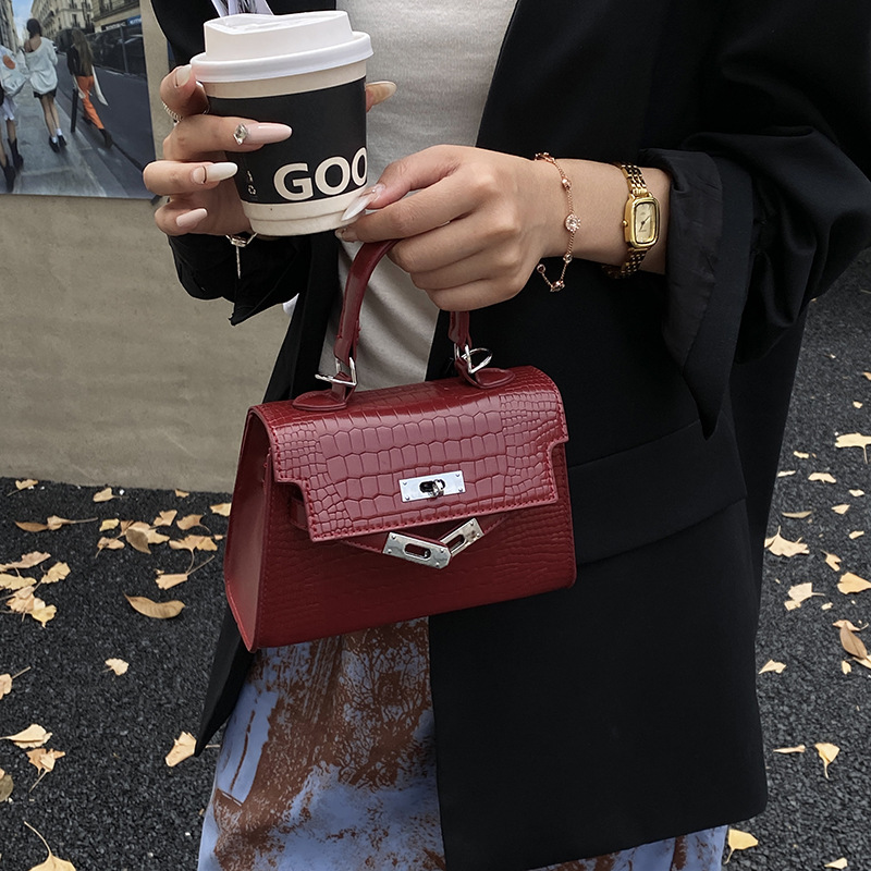 Bolsos de piedra de alta calidad para mujeres 2025, nuevos bolsos de moda portátiles de invierno versátiles mochila de viaje