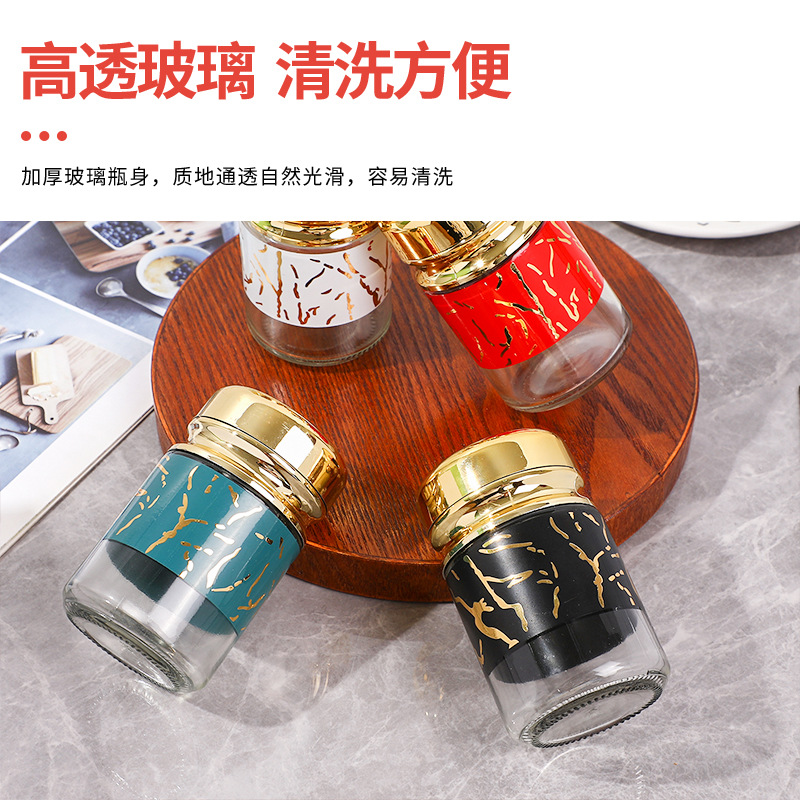 Tarro de condimento de cocina Caja de condimento de lujo ligero Tarro de condimento para el hogar Tarro de azúcar de sal roja de red Juego de combinación de condimento de vidrio