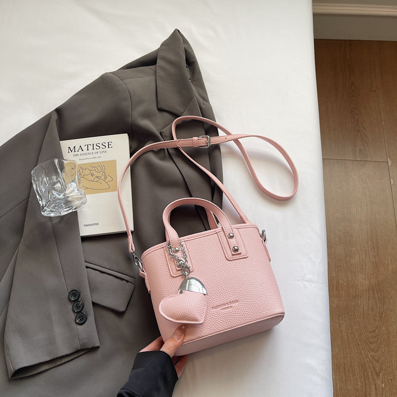 Bolso de cubo portátil transfronterizo simple y de alta gama para mujer 2025 nuevo bolso de hombro de estilo occidental de todo fósforo bolso de mensajero de moda