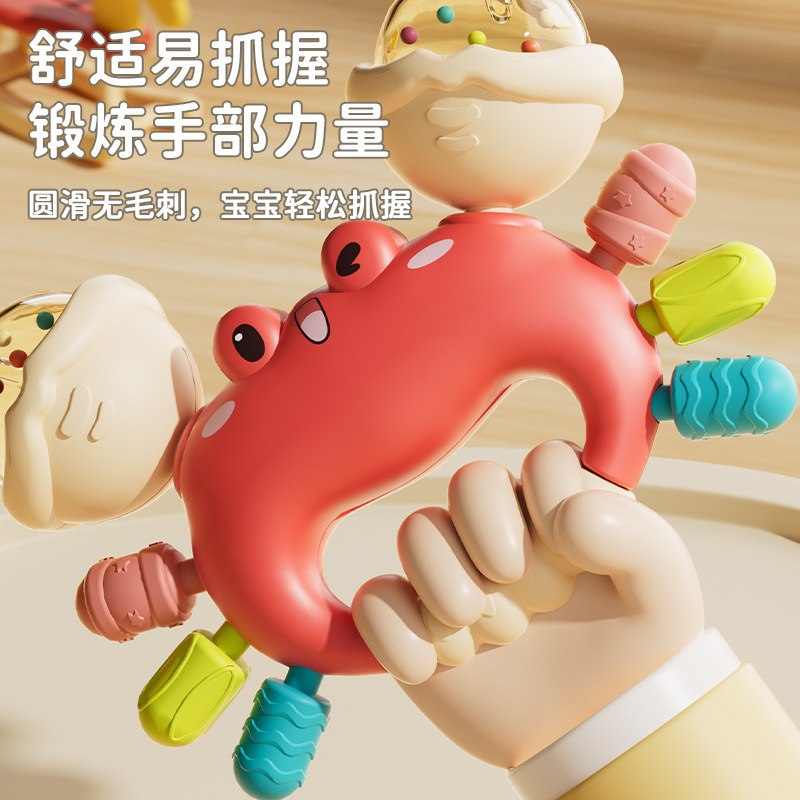 新生児のおもちゃの鈴の歯のゴムの手のカニの赤ちゃんのおもちゃの砂のハンマーは0から6ヶ月の赤ちゃんのおもちゃのカニをかじります。|undefined