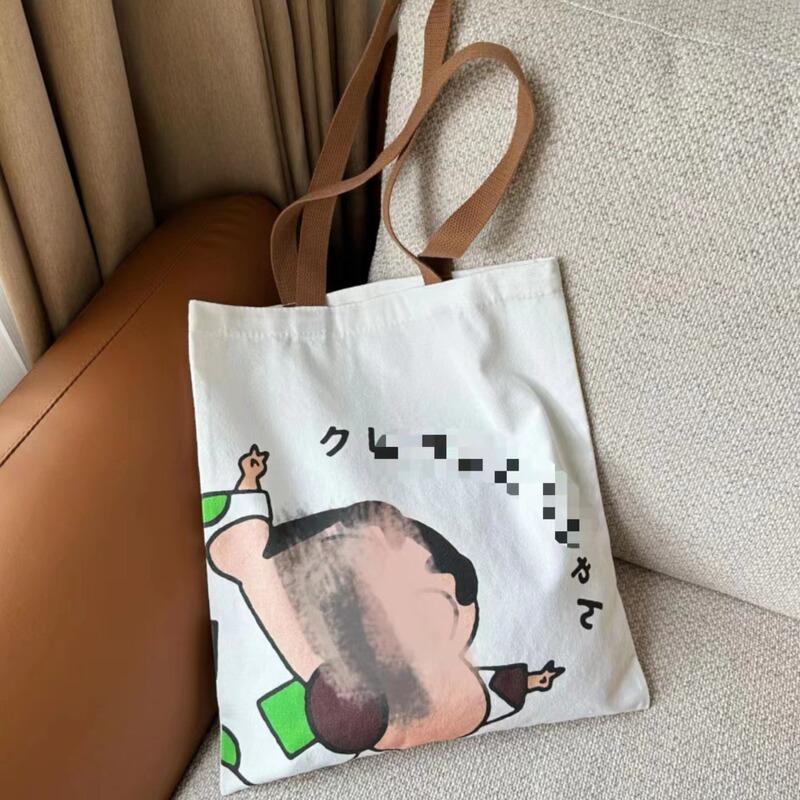 クレヨンの包みの女性のかわいい手描きの漫画の学生の大容量のキャンバスの包みの授業の韓国版の手提げのショッピングバッグの新しいです。|undefined
