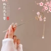 Fuchsia Chinese hairpin with tassels, cat's eye