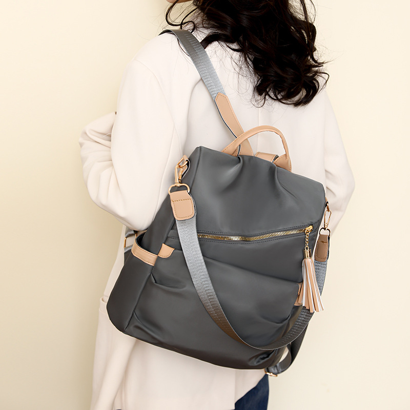 Spot al por mayor 2025 nueva mochila antirrobo casual para mujer moda borla mochila para mujer de gran capacidad marea