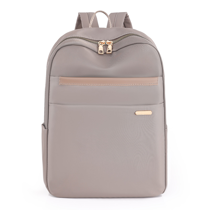 2023 nueva mochila de nailon para mujer de gran capacidad simple y versátil mochila de computadora para estudiantes de secundaria al por mayor
