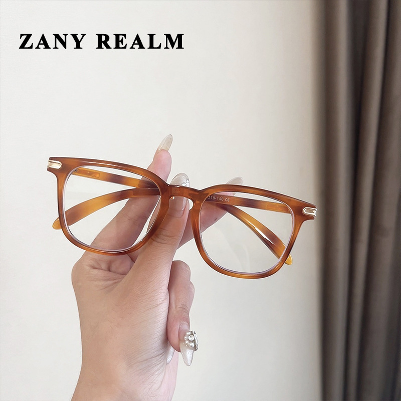 Nuevo marco negro anti-azul claro gafas lisas en línea celebridad ins grano de madera dulce chica Colegio caja miopía gafas fabricante en stock