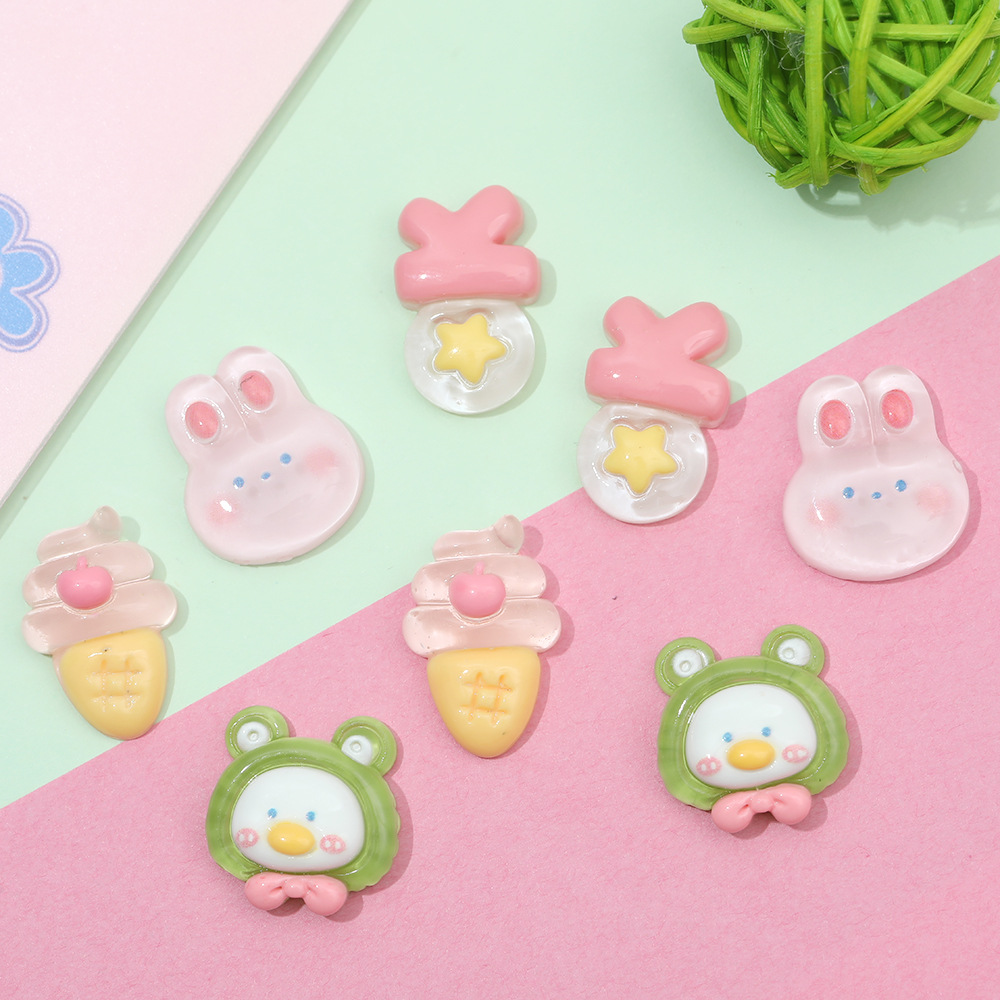 Rosa de dibujos animados conejo congelado DIY accesorios de resina crema pegamento caja del teléfono accesorios para el cabello clip de oído material de parche al por mayor