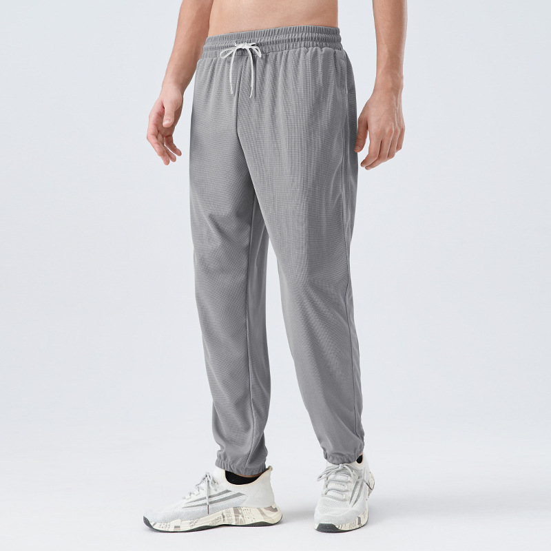 Pantalones deportivos de tejido para hombres respirantes absorbientes de humedad secado rápido entrenamiento de maratón de atletismo para correr pantalones casuales
