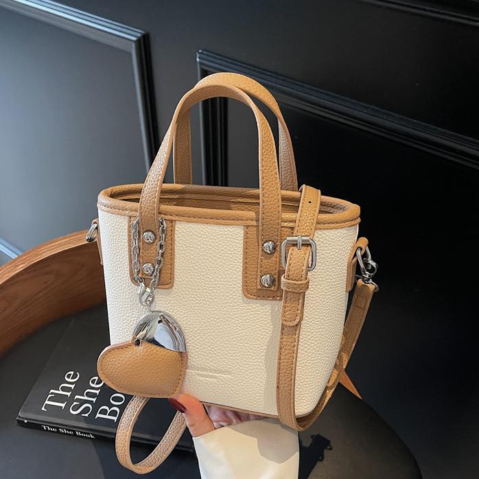 Bolso de cubo portátil transfronterizo simple y de alta gama para mujer 2025 nuevo bolso de hombro de estilo occidental de todo fósforo bolso de mensajero de moda