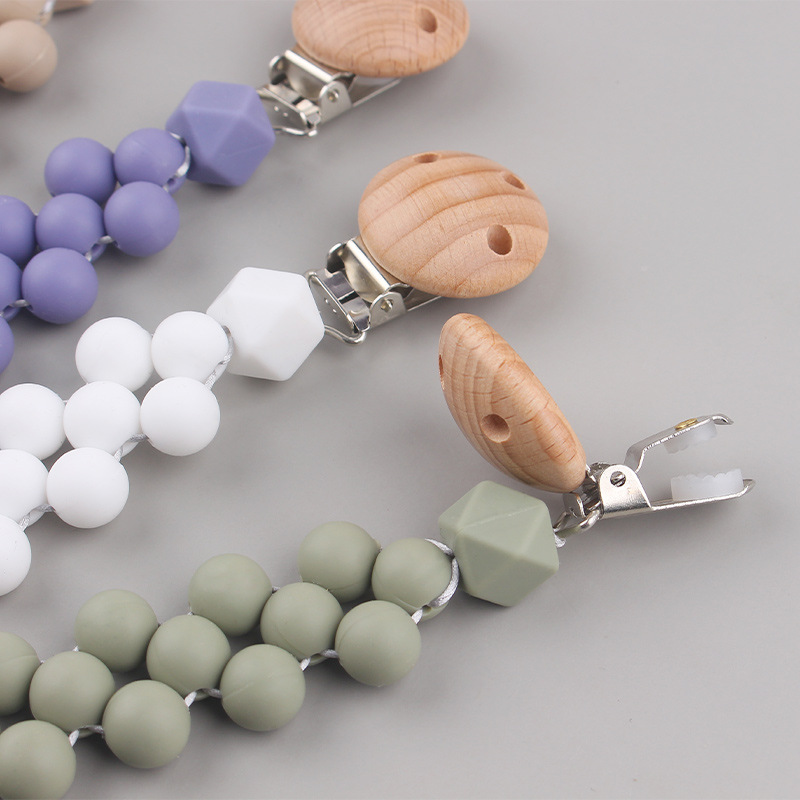 Productos para bebés Clip de chupete de madera de haya Cuentas de colores de dibujos animados para bebés creativos Morderse los dientes Cadena de chupete anti-caída