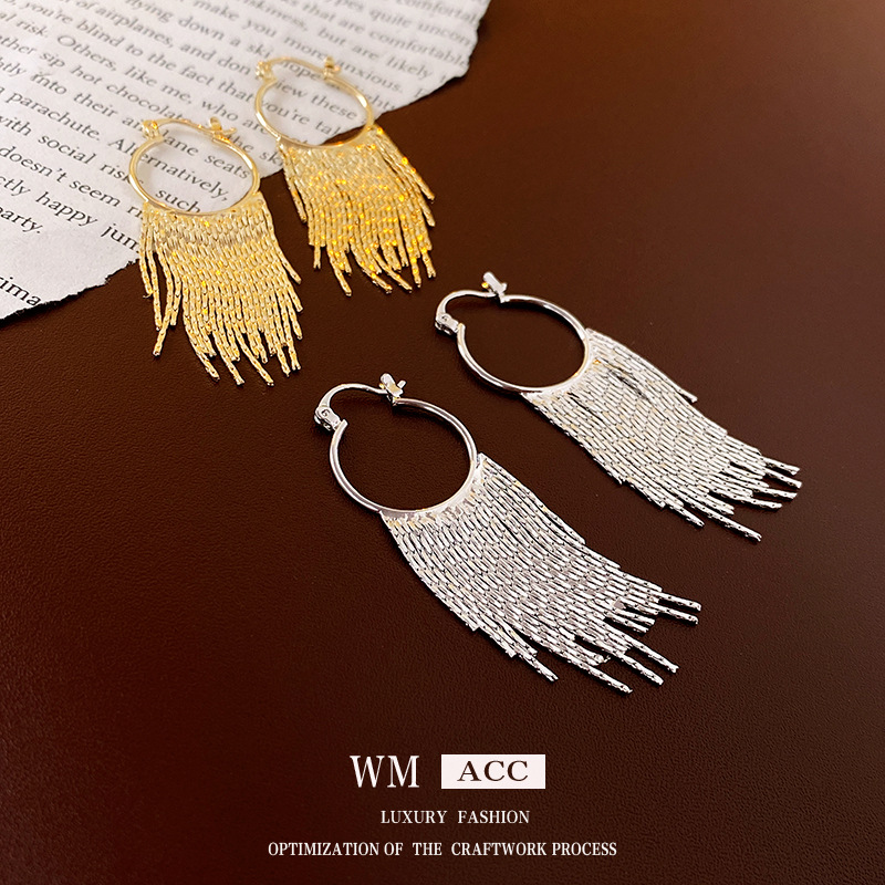 Oro Real electrochapado ronda borla oreja hebilla pendientes de metal de estilo frío pendientes de moda europea y americana pendientes personalizados para las mujeres al por mayor