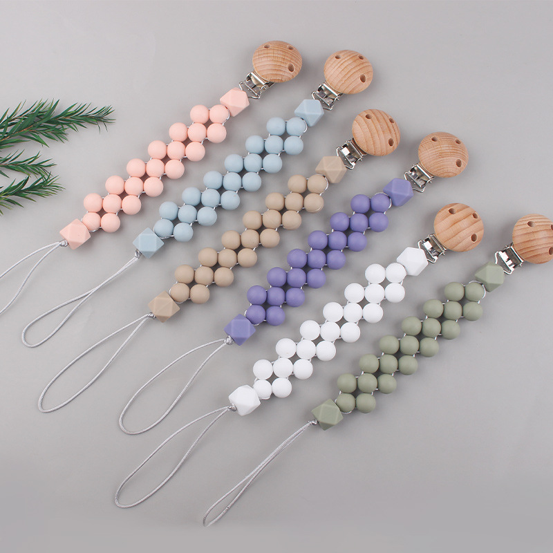 Productos para bebés Clip de chupete de madera de haya Cuentas de colores de dibujos animados para bebés creativos Morderse los dientes Cadena de chupete anti-caída