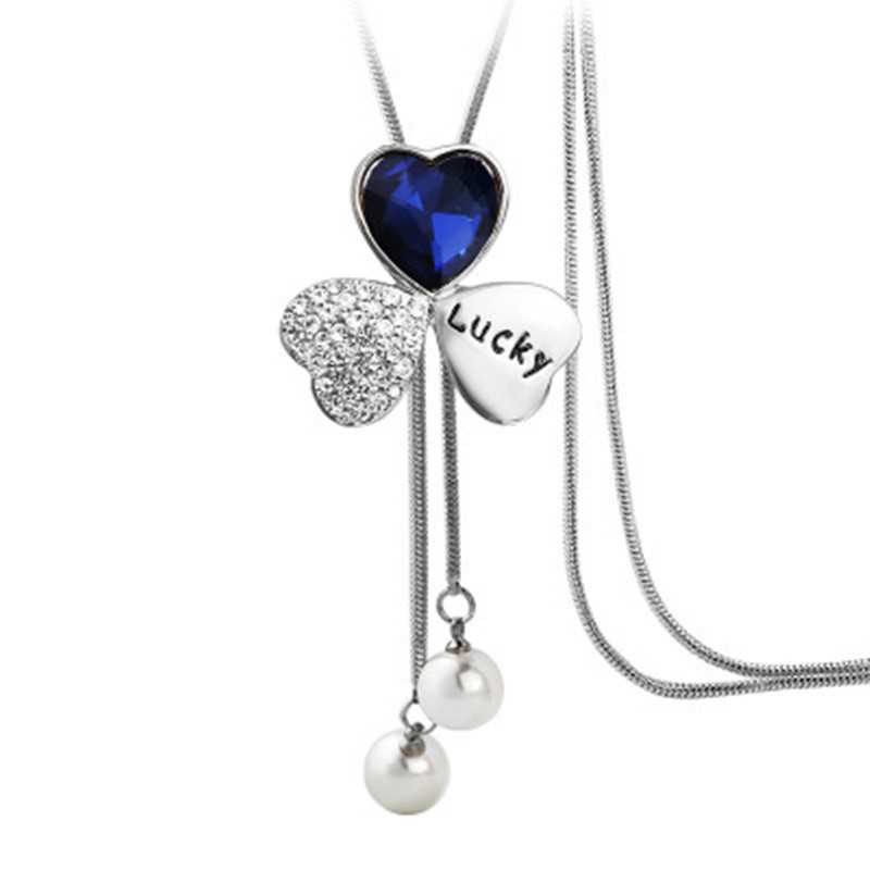 Corea del Sur moda Lucky Clover suéter cadena larga otoño Mujer Todo fósforo suéter colgante flor accesorios collar nuevo