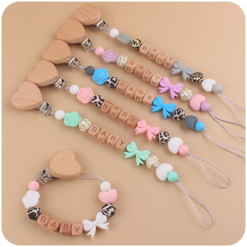 Nuevo bebé suministros dibujos animados amor Haya clip calmante bebé silicona arco pezón cadena anti-caída