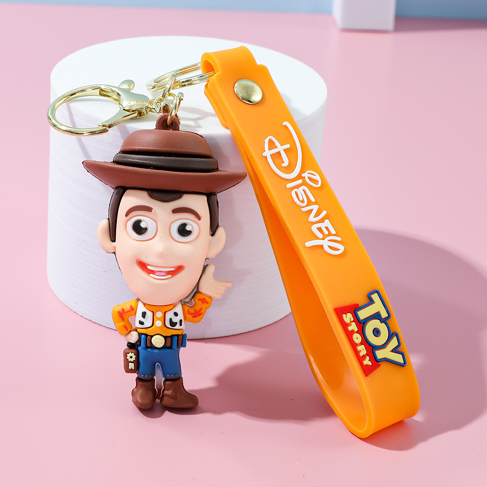 Llavero de silicona de Toy Story, el popular dibujo animado, con personajes como el alienígena de tres ojos, Buzz Lightyear y el oso Lotso, ideal como adorno para bolso.
