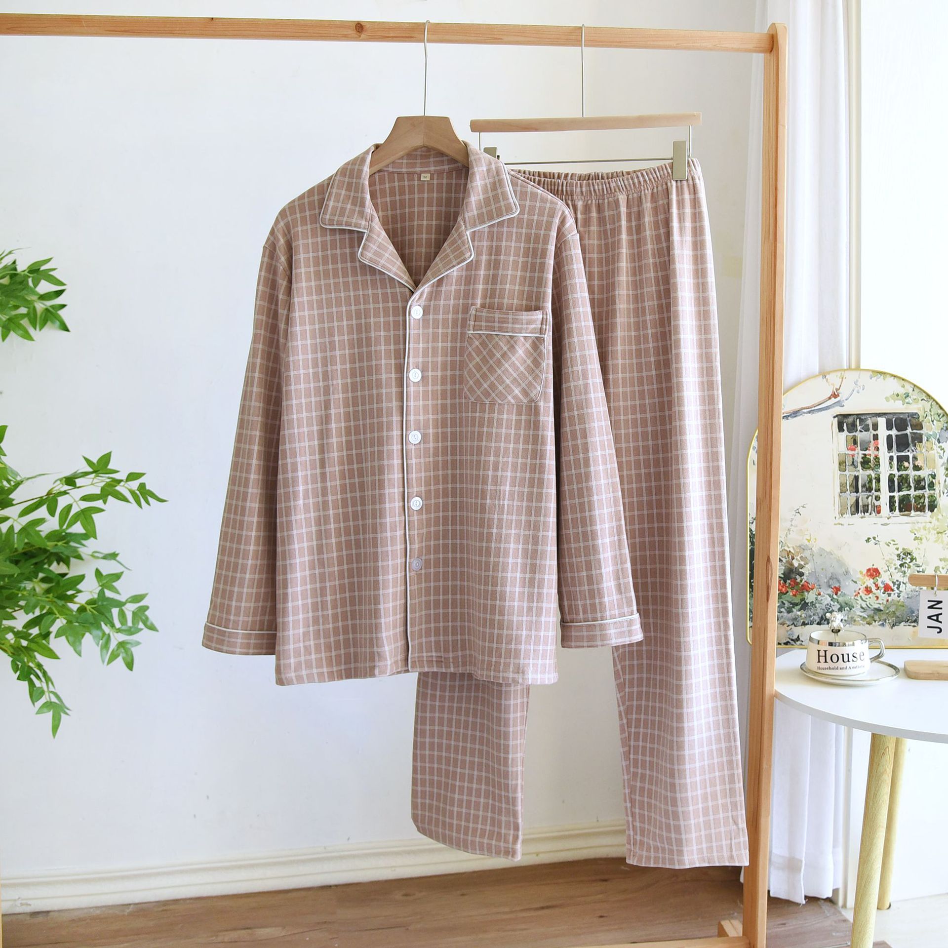 春と秋の冬の新型デコルテのカップルの長袖のズボンの家庭服は簡単でカジュアルな大きいサイズの男性の女性のパジャマのスーツです。