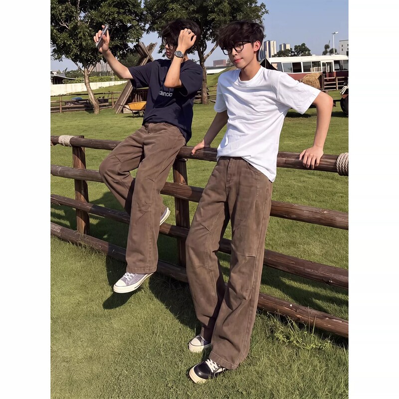 Men's autumn work pants in a Maillard brown color, featuring a pleated, vintage wash denim design with a straight-leg, slightly flared cut
