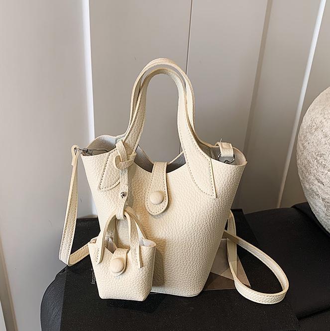 Tendencia de comercio exterior, bolsa de cubo de mano de nicho para mujer 2025 nuevo bolso de hombro casual de todo fósforo bolso de mensajero de moda de estilo occidental