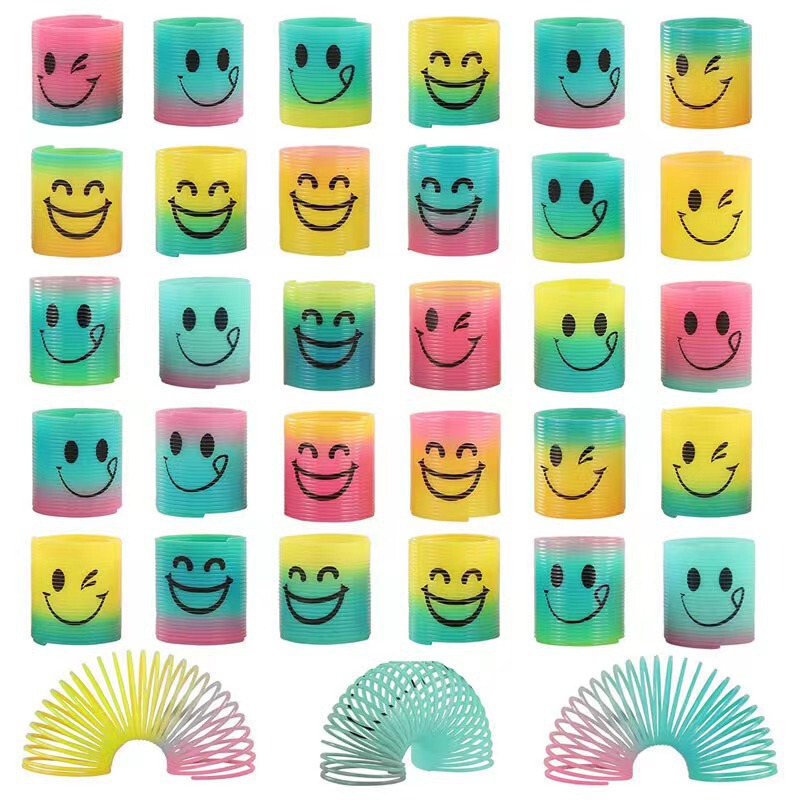 子供の魔力の虹の輪の表情の笑顔の虹のスプリングの輪の露店の弾力の積み重ねの輪の知育のノスタルジックなおもちゃ|undefined