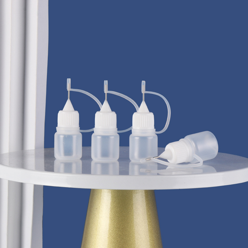 Fabricante en stock botella de aguja 10ml30ml botella de aceite esencial pe plástico semipermeable pigmento pegamento botella de inyección de pintura suave botella