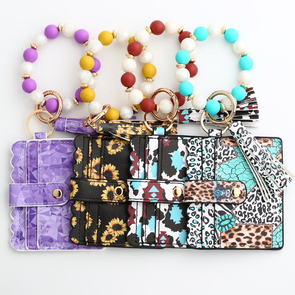 Casual Ethnic Style Sunflower Solid Color Leopard Pu Leather Beaded Tassel Keychain display picture 6